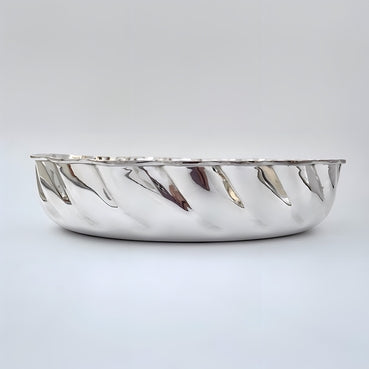 Silver bread basket on a light gray background