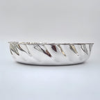 Silver bread basket on a light gray background