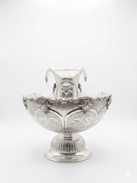 Decorative silver bowl and natla set with intricate engravings on a white background