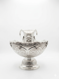 Decorative silver bowl and natla set with intricate engravings on a white background