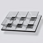 Clear glass serving tray with divided sections on a light gray background