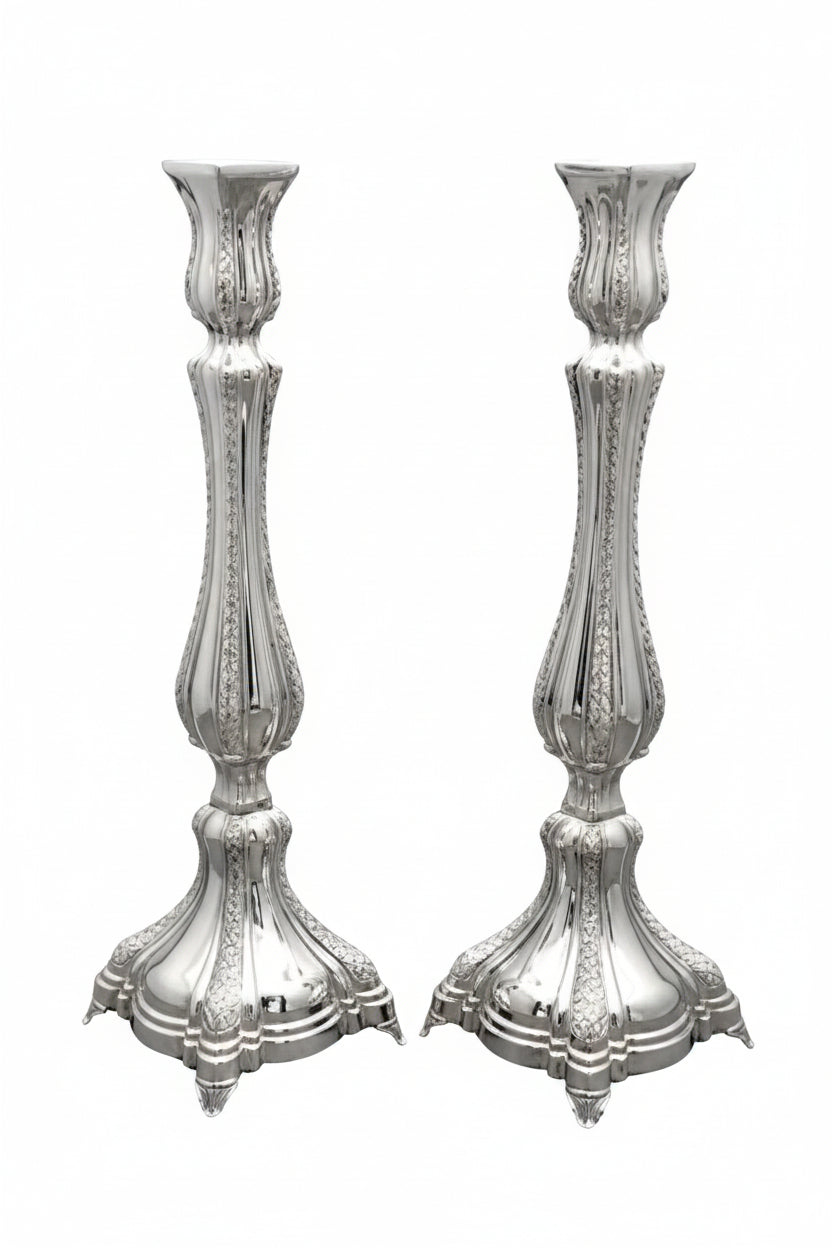 Two silver candlesticks on a white background