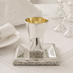 Hadad bros A silver Kiddush cup with a gold interior, set on a matching square silver tray with a decorative Jerusalem cityscape border