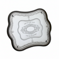 Two decorative challah bread trays with intricate designs on a white background
