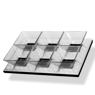 Clear glass serving tray with divided sections on a light gray background