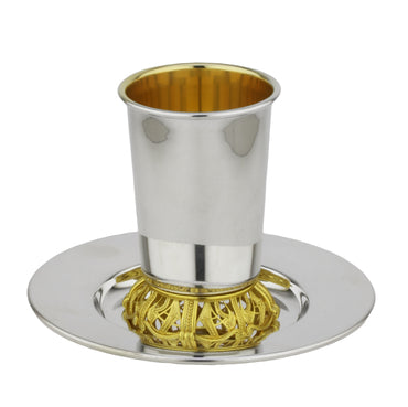 Silver and gold cup with a matching tray on a white background