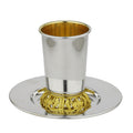Silver and gold cup with a matching tray on a white background